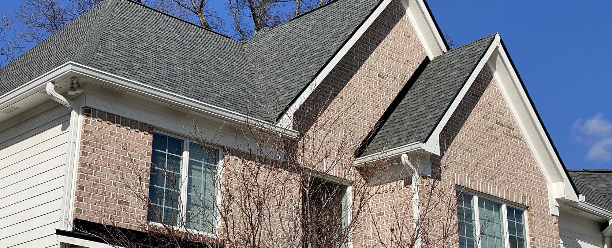 our roofing contractors in Columbus, IN completing a roof replacement