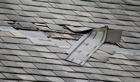 Damaged asphalt roof in Indiana