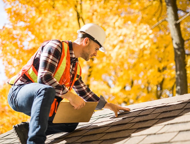 fishers residential roof inspector examining roof
