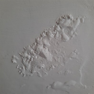 inspecting wall condition during roof inspection in Fishers, IN